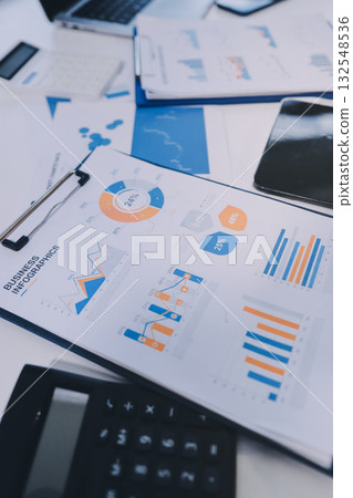 Accounting company provide finance and taxation planning for profitable cash flow, Auditor and accountant team working in office, analyze financial data and accounting record with calculator.Insight Accounting company provide finance and taxation planning for profitable cash flow, Auditor and accountant team working in office, analyze financial data and accounting record with calculator.Insight 132548536