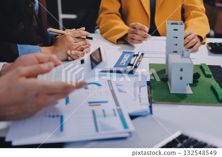 Real estate agent and customer signing contract to buy house, insurance or loan real estate.rent a house,get insurance or loan real estate or property. Real estate agent and customer signing contract to buy house, insurance or loan real estate.rent a house,get insurance or loan real estate or property. 132548549