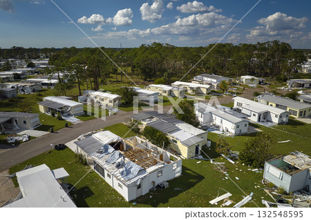 Severely damaged houses after hurricane Ian in Florida mobile home residential area. Consequences of natural disaster Severely damaged houses after hurricane Ian in Florida mobile home residential area. Consequences of natural disaster 132548595