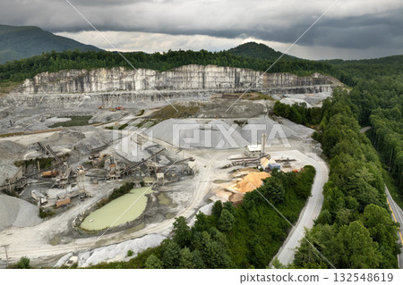 Sand open-pit mining quarry with processing plant for crushed stone. Extracting of natural resources for construction industry Sand open-pit mining quarry with processing plant for crushed stone. Extracting of natural resources for construction industry 132548619