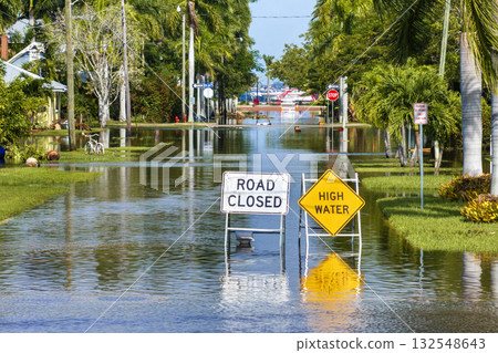 Road closed because of flooding danger with warning signs blocking driving of cars. Hurricane Milton aftermath in Punta Gorda, Florida Road closed because of flooding danger with warning signs blocking driving of cars. Hurricane Milton aftermath in Punta Gorda, Florida 132548643