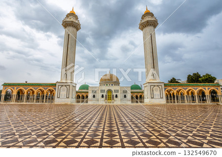 Square in front of mausoleum of Habib Bourguiba with two minarets on a cloudy day with decorated marble courtyard, Monastir, Tunisia Square in front of mausoleum of Habib Bourguiba with two minarets on a cloudy day with decorated marble courtyard, Monastir, Tunisia 132549670