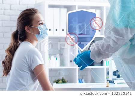 Medical professional conducts COVID-19 test with patient in a clinic setting 132550141