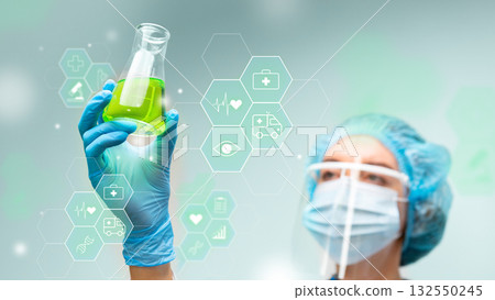 Scientist examines green liquid in laboratory, focusing on health and research innovations 132550245