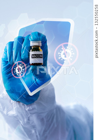 Healthcare worker holds vaccine vial to demonstrate protection against diseases Healthcare worker holds vaccine vial to demonstrate protection against diseases 132550258