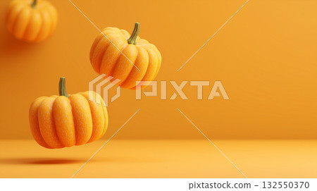 Levitating orange pumpkins on warm background, modern autumn and Halloween concept with copy space 132550370