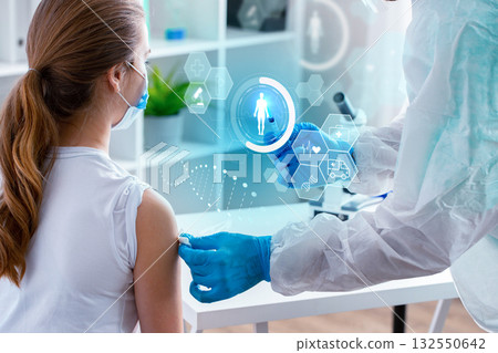 Health professional administering vaccine to a patient in a modern clinic setting Health professional administering vaccine to a patient in a modern clinic setting 132550642