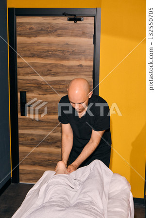 Experience a professional massage in a soothing environment designed for your comfort 132550705