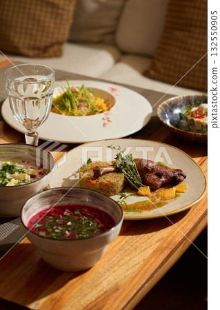 An Exquisite and Delicious Culinary Presentation Showcasing Gastronomic Dishes, Artfully Arranged An Exquisite and Delicious Culinary Presentation Showcasing Gastronomic Dishes, Artfully Arranged 132550905