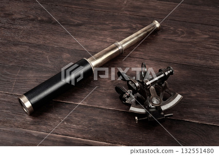 Vintage spyglass telescope with sextant 132551480