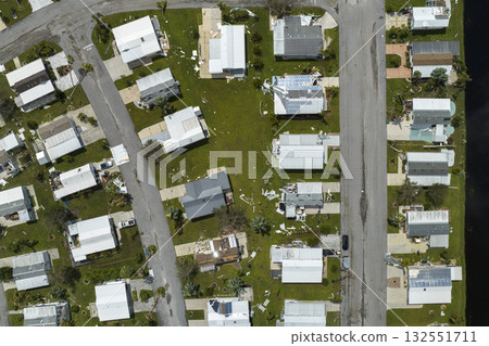 Property damage from strong hurricane winds. Mobile homes in Florida residential area with destroyed rooftops. Consequences of natural disaster 132551711