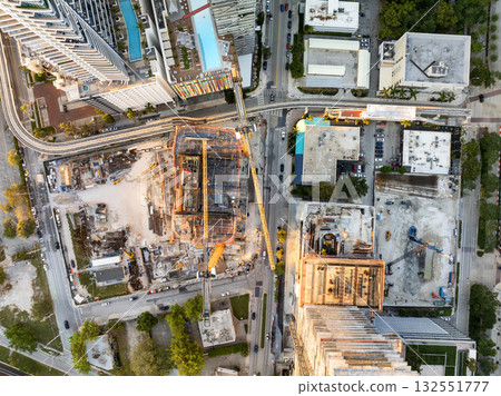 New construction site in Miami, Florida au sunset. Developing residence in American urban area. Concept of housing growth in the USA New construction site in Miami, Florida au sunset. Developing residence in American urban area. Concept of housing growth in the USA 132551777