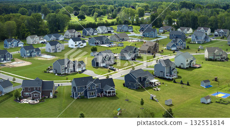 Low-density two story private homes with large lot size and green grassy lawns in summer season. Rural residential suburbs with upscale suburban houses outside of Rochester, New York 132551814