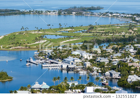Large residential homes in island small town Boca Grande on Gasparilla Island in southwest Florida. American waterfront houses in rural US suburbs Large residential homes in island small town Boca Grande on Gasparilla Island in southwest Florida. American waterfront houses in rural US suburbs 132551827