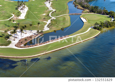 Large golf course and sports grounds with green grass in Boca Grande, small town on Gasparilla Island in southwest Florida 132551829