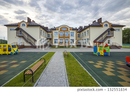 Kindergarten preschool building with big windows. Architecture and development concept. 132551834