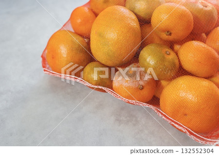 Tangerines that were poorly stored and have become moldy. 132552304