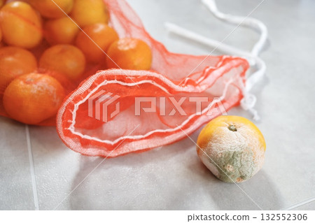 Tangerines that were poorly stored and have become moldy. Tangerines that were poorly stored and have become moldy. 132552306