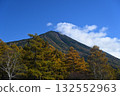 Autumnal foliage of the larch forest and cloud-covered Mount Nantai 132552963
