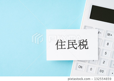 Resident tax text and calculator on a light blue background Resident tax text and calculator on a light blue background 132554859
