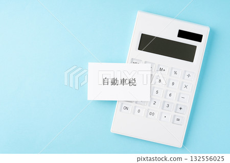 Automobile tax text and calculator on light blue background 132556025