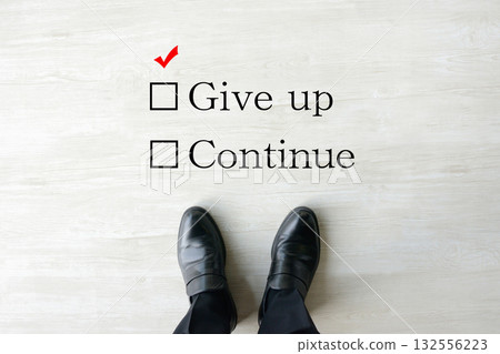 The feet of businessmen who are unsure whether to continue their business or company or give up 132556223