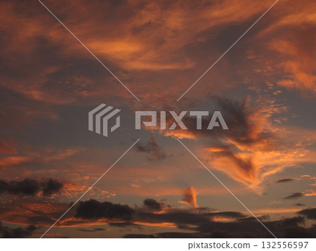 Orange clouds in the western sky Orange clouds in the western sky 132556597