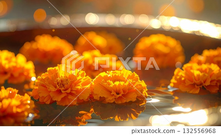 A stunning bouquet of bright yellow and orange flowers, including marigolds. 132556968