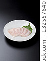 Sawara sashimi served on a plate against a black background 132557640