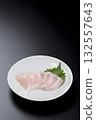 Sawara sashimi served on a plate against a black background 132557643