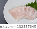 Sawara sashimi served on a plate against a black background 132557645