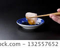 Sawara sashimi served on a plate against a black background 132557652