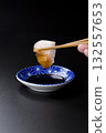 Sawara sashimi served on a plate against a black background 132557653