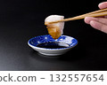 Sawara sashimi served on a plate against a black background 132557654