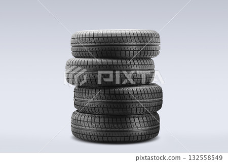 Four winter tires are stacked together, ready for off-season storage. These tires feature velcro and are designed for optimal friction in cold conditions. Four winter tires are stacked together, ready for off-season storage. These tires feature velcro and are designed for optimal friction in cold conditions. 132558549