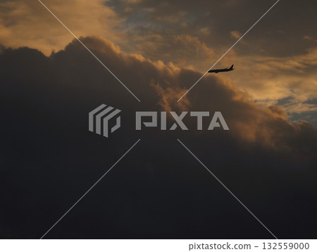 Airplane flying in a beautiful sunset sky 132559000