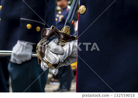 Soldier holding command saber, Military with sword in ceremony, Armed forces in protocol act 132559018