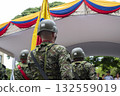 Soldiers with Colombian flag in background, Colombian military in formation, Armed forces with national patriotic symbol 132559019