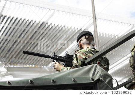 Soldier with silencer on weapon, Armed military in special operation, Colombian special forces in action Soldier with silencer on weapon, Armed military in special operation, Colombian special forces in action 132559022