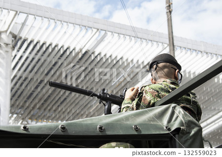 Soldier using weapon with silencer, Military with equipped rifle, Armed forces in tactical operation Soldier using weapon with silencer, Military with equipped rifle, Armed forces in tactical operation 132559023