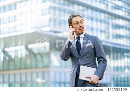 Businessman outdoor portrait smartphone Businessman outdoor portrait smartphone 132559199