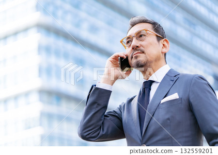 Businessman outdoor portrait smartphone 132559201