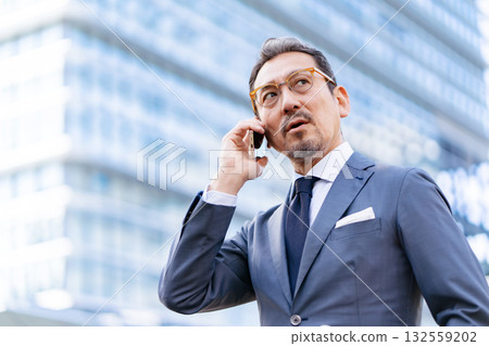 Businessman outdoor portrait smartphone Businessman outdoor portrait smartphone 132559202