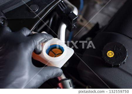 Checking car's brake fluid Checking car's brake fluid 132559750