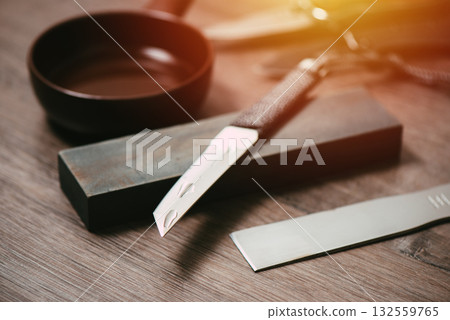 Knife sharpening with whetstone 132559765