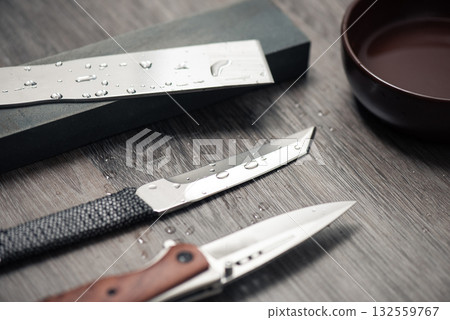 Knife sharpening with whetstone Knife sharpening with whetstone 132559767