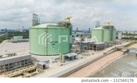 Natural gas storage. LPG tank at sea shore. large LNG or liquefied propane tank at ocean seaside. 132560176