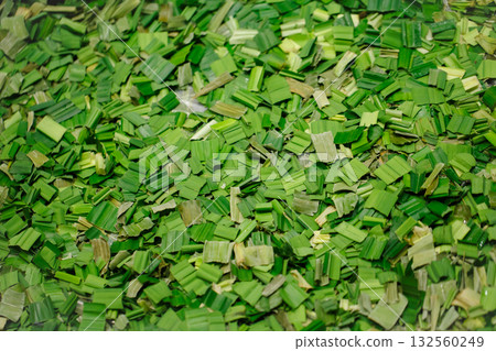 Pandanus leaves chopped for drying to make tea or oil extract, Thai cooking desserts favor. Pandanus leaves chopped for drying to make tea or oil extract, Thai cooking desserts favor. 132560249