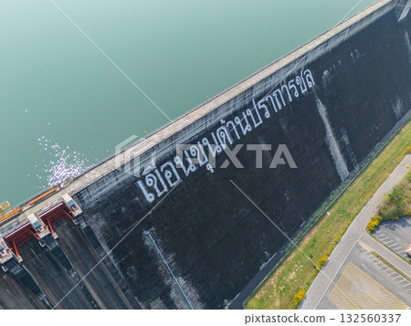Khuean Khun Dan Prakanchon Dam in Thailand with low water level reserved in dry summer season 132560337