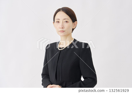 Woman in mourning clothes, white background, portrait, looking at camera Woman in mourning clothes, white background, portrait, looking at camera 132561929
